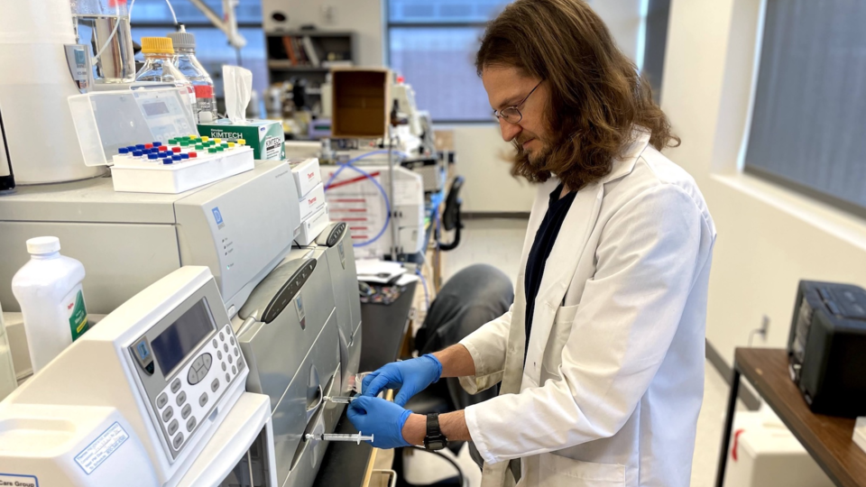 Richard Zbasnik conducting an analysis on food sample