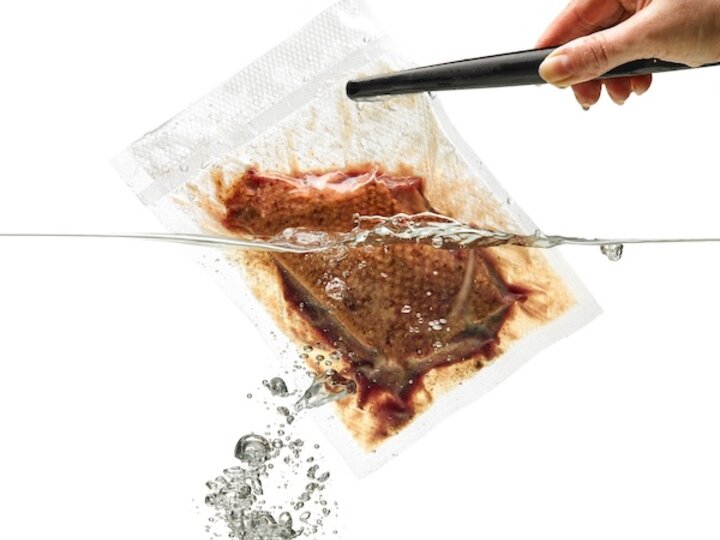 vacuum bagged meat in water