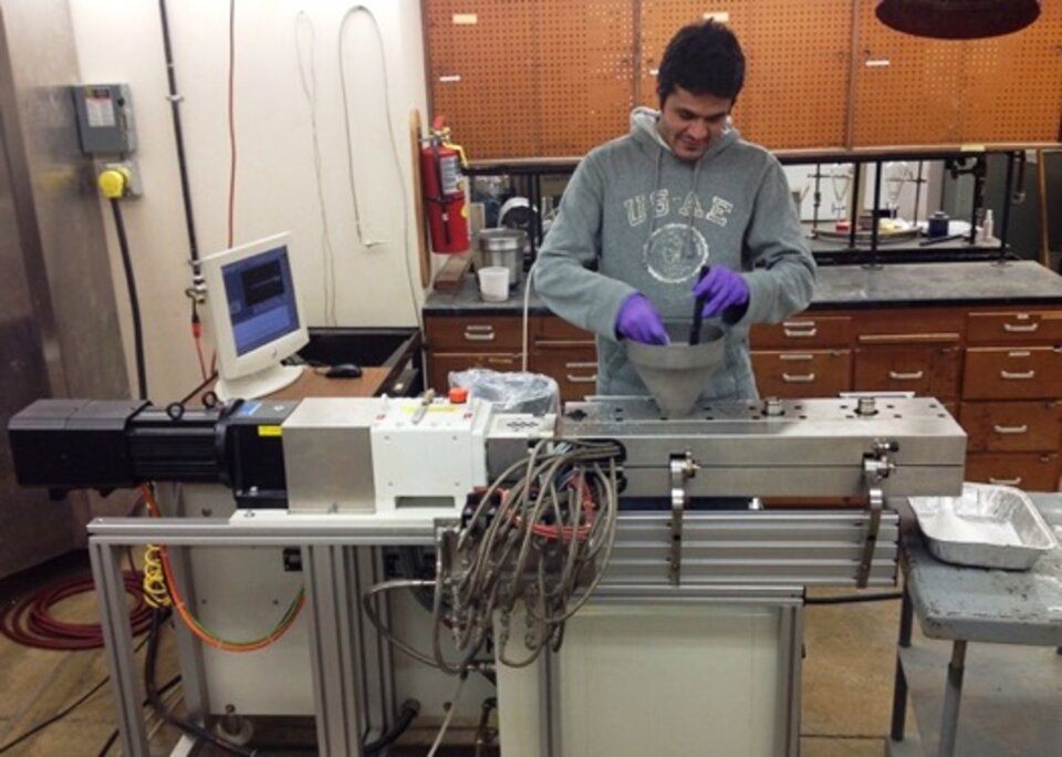 Worker in extrusion lab